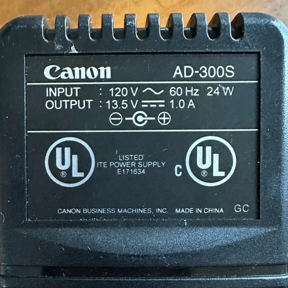 Genuine Canon AD-300S power supply input: 120V ~ 60 Hz 24W output: 13.5V 1.0A